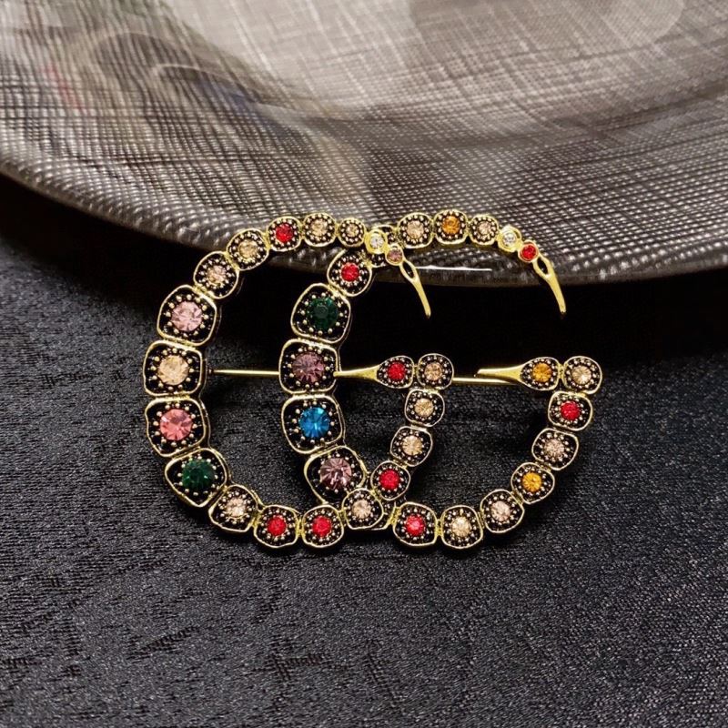 Gvc*1 brooches